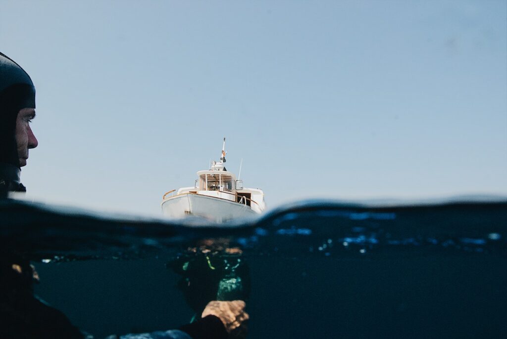 Divers at the surface left behind