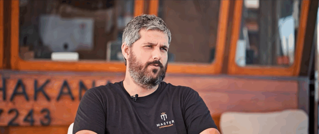 Guislain, the knowledgeable cruise director and dive guide aboard Indo Master, standing on deck ready for the next dive adventure.