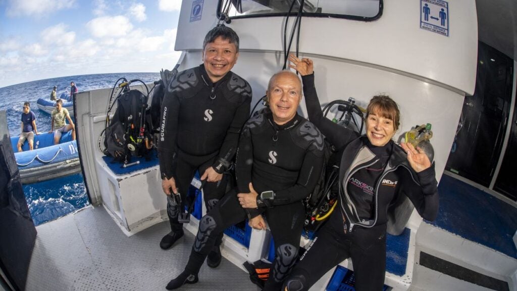 Divers ready to dive on the dive deck of Galapagos Master before a morning dive.