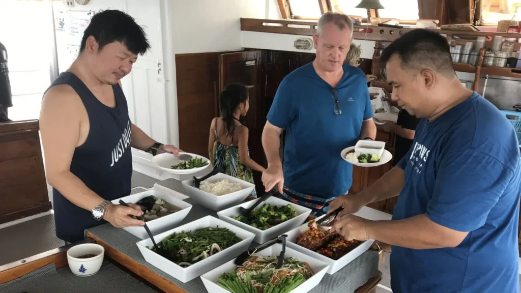 A buffet spread of colourful, authentic Thai dishes await on a Thailand liveaboard.