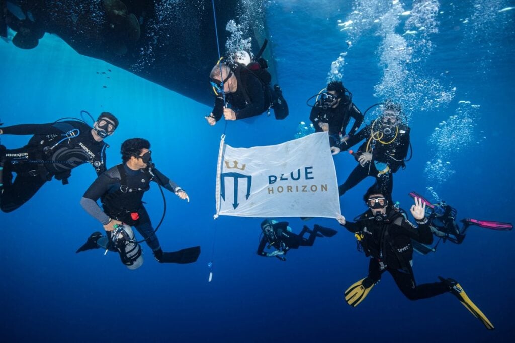 Group of divers by Blue Horizon shot line enjoying diving the Red Sea reefs and wrecks