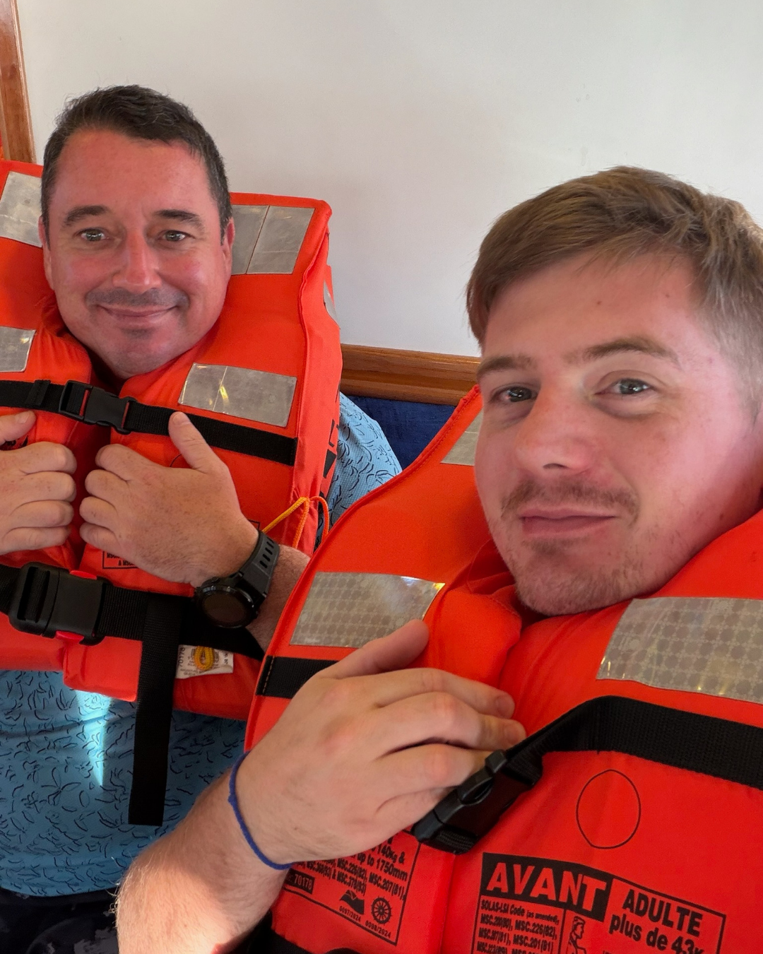 Two Master Liveaboards guests in life jackets before a Galapagos dinghy ride